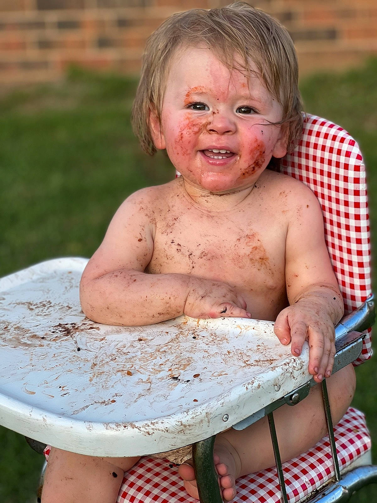 Ivan is registered to the contest to win money with this photo: bathing, cheek, chest, child, fun, grass, hair, happy, leisure, muscle, pattern, people_in_nature, person, photograph, play, recreation, sitting, skin, smile, thumb