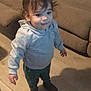 Isaac joined the competition — help win amazing prizes! boots, brown, casual, child, clothing, couch, cute, floor, furniture, hair, home, hoodie, indoors, pants, person, shadow, smiling, standing, toddler, young_child