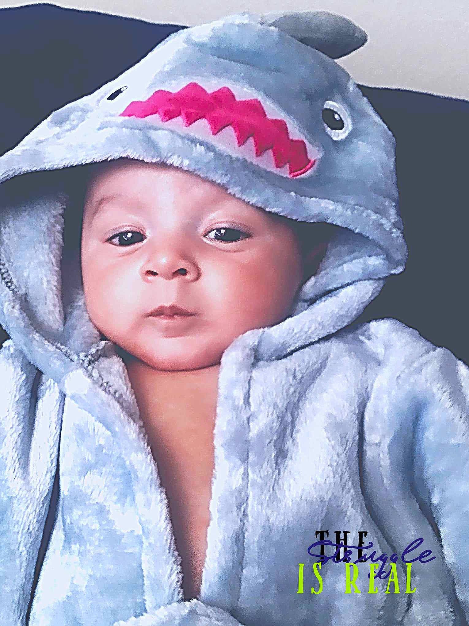 Dax is registered to the contest to win money with this photo: baby, baby_toddler_clothing, beanie, cap, cheek, child, costume_hat, electric_blue, eyebrow, face, fashion_accessory, flash_photography, freezing, happy, headgear, headwear, knit_cap, outerwear, person, sleeve