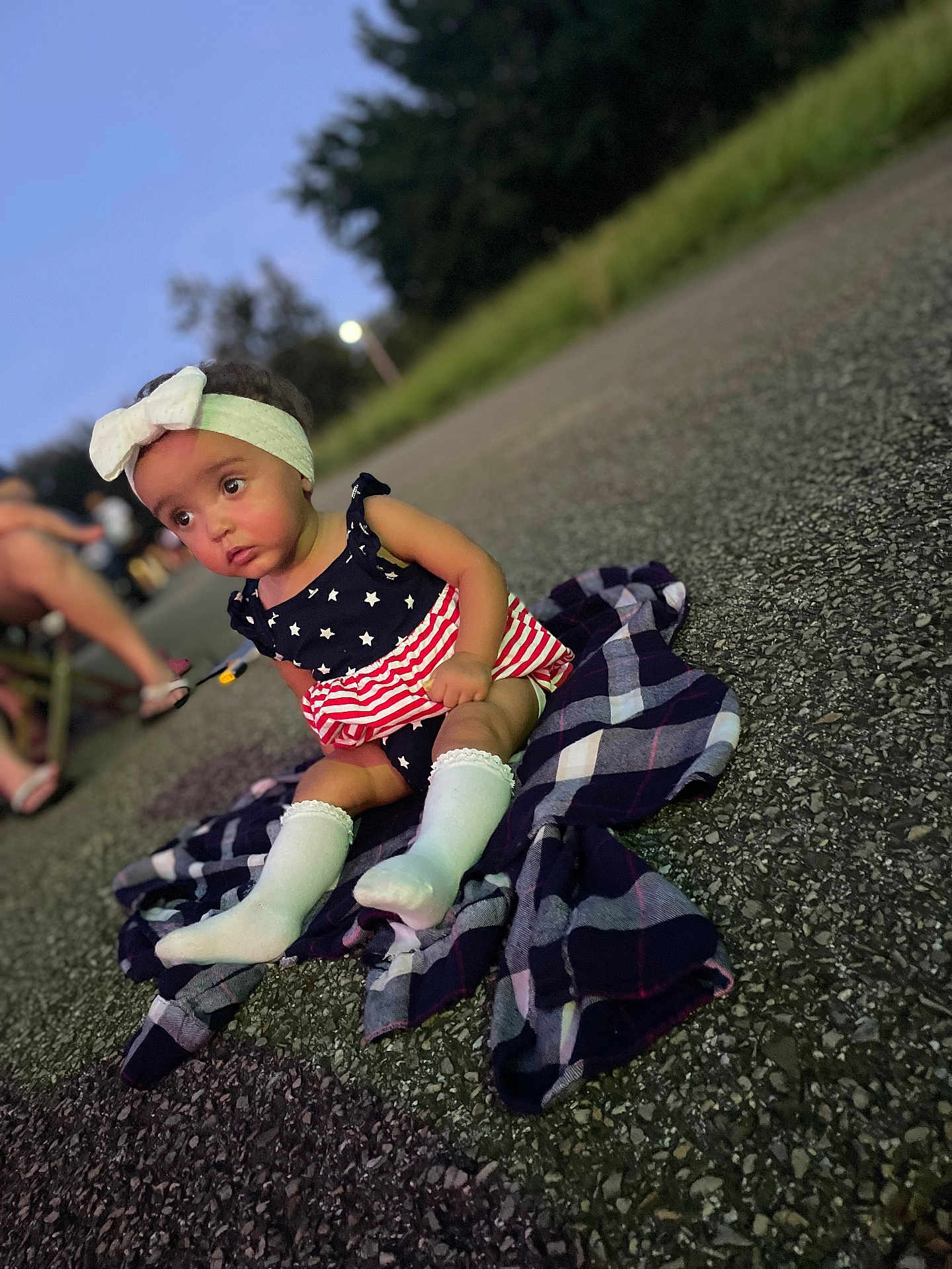 Brexley joined the competition — help win amazing prizes! toddler, child, baby, headband, bow, dress, stars, stripes, socks, blanket, plaid, asphalt, outdoor, evening, twilight, grass, trees, person, portrait, sitting