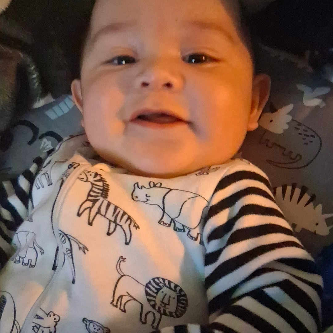 Learick Lee is registered to the contest to win money with this photo: animal, baby, bodypart, cat, clothing, cushion, face, happy, head, homedecor, laughing, newborn, person, pet, photography, portrait, skin, smile, t_shirt, tattoo