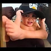 Learick Lee is registered to the contest to win money with this photo: baby, casual, child, clothing, couch, cute, face, happy, hat, headwear, indoor, person, playful, portrait, relax, sitting, skin, smile, toddler, young