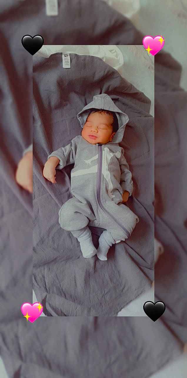 Benjamin Jr. joined the competition — help win amazing prizes! baby, baby_products, baby_toddler_clothing, cap, child, comfort, hat, linens, magenta, pattern, peach, person, pink, room, sitting, sleeve, toddler