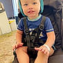 Diego Pieddefer participe au concours pour gagner de l'argent avec cette photo : toddler, child, stroller, hat, blue_eyes, blue_shirt, harness, outdoor, grass, curious, baby, seat, foot, hand, face, expression, sunlight, casual_clothing, cute, smiling