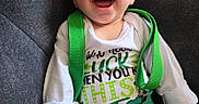 Zayden joined the competition — help win amazing prizes! baby, child, infant, smiling, laughing, portrait, close_up, indoor, couch, seated, green_clothing, suspenders, shamrocks, festive, white_shirt, happy, face, hands, casual, photography