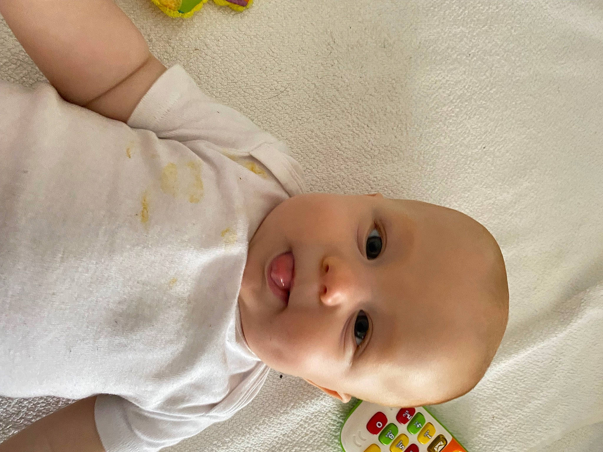 Ayden participe au concours pour gagner de l'argent avec cette photo : baby, baby_products, baby_safety, baby_toddler_clothing, child, comfort, gesture, insect, linens, nose, pattern, person, plaid, pollinator, skin, sleeve, smile, toddler, wrist