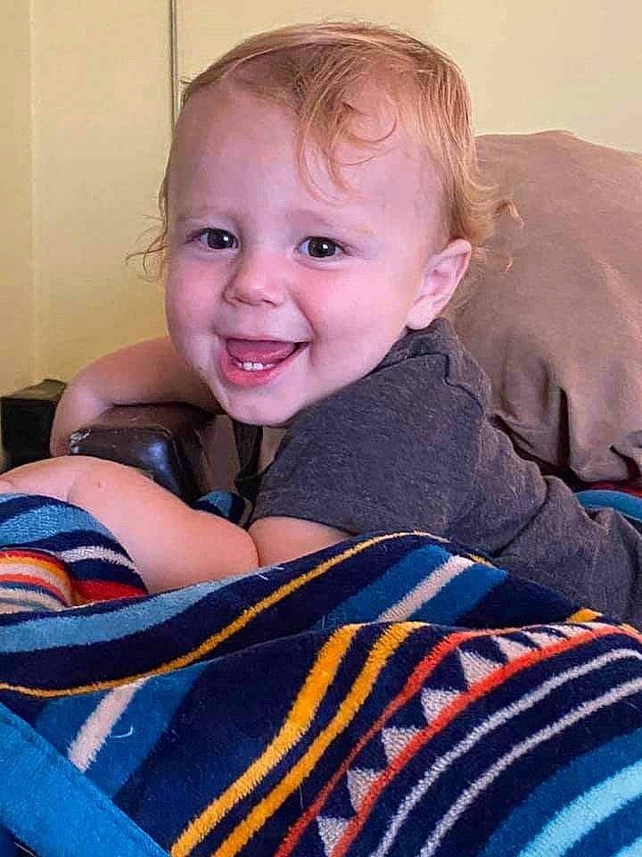 Ryker joined the competition — help win amazing prizes! arm, azure, baby, baby_toddler_clothing, cheek, comfort, couch, face, facial_expression, hair, hairstyle, happy, head, iris, joy, nose, person, skin, sleeve, smile