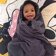 Samantha joined the competition — help win amazing prizes! baby, child, smiling, towel, wrapped, happy, face, portrait, indoors, blanket, cartoon, colorful, cute, cozy, infant, expression, person, young, lying, soft