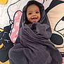 baby, child, smiling, towel, wrapped, happy, face, portrait, indoors, blanket, cartoon, colorful, cute, cozy, infant, expression, person, young, lying, soft