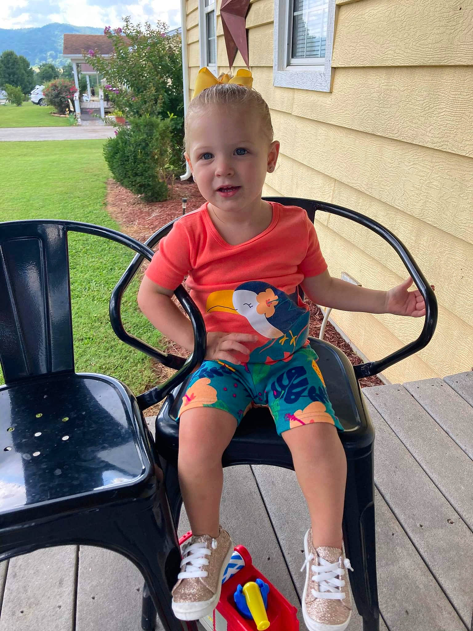 Diana is registered to the contest to win money with this photo: baby_toddler_clothing, chair, child, cloud, electric_blue, eyewear, fun, grass, happy, leisure, person, play, public_space, recreation, shorts, sky, smile, summer, toddler, tree