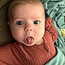 Zaliyah joined the competition — help win amazing prizes! baby, infant, tongue, face, expression, blanket, clothing, blue_eyes, cute, child, lying_down, texture, cozy, portrait, indoors, skin, head, mouth, person, young