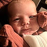 Zaliyah is registered to the contest to win money with this photo: baby, close_up, face, infant, child, cute, skin, eyes, clothing, blanket, indoors, portrait, young, person, soft_lighting, warm_colors, expression, head, cheeks, resting