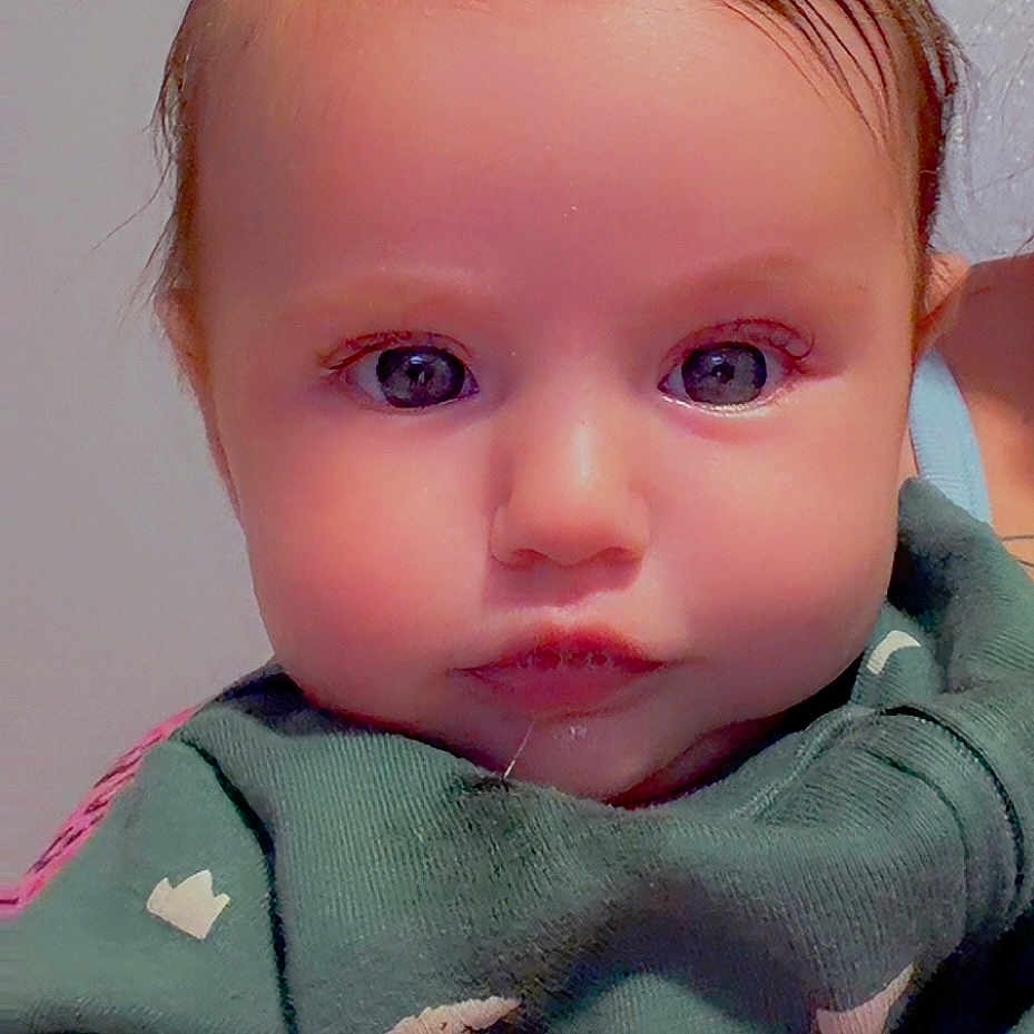 Baylynn is registered to the contest to win money with this photo: adorable, baby, child, closeup, clothing, cute, eyes, face, hand, heart_shape, indoor, infant, person, portrait, sheep_pattern, skin, soft_lighting, sweater, warmth, young