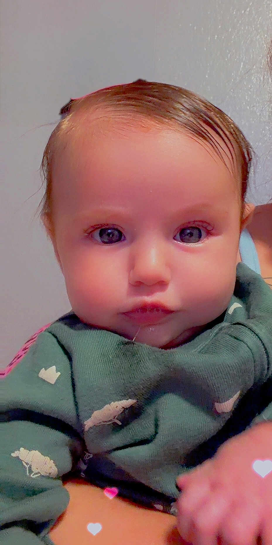 Baylynn is registered to the contest to win money with this photo: baby, infant, face, eyes, sweater, clothing, sheep_pattern, hand, person, skin, cute, closeup, portrait, child, young, indoor, soft_lighting, heart_shape, adorable, warmth