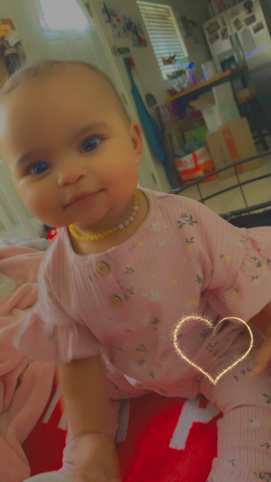 Jaslynn is registered to the contest to win money with this photo: baby, baby_laughing, baby_products, baby_toddler_clothing, cheek, child, dress, embellishment, fun, happy, linens, pattern, peach, person, pink, room, shelf, skin, sleeve, smile