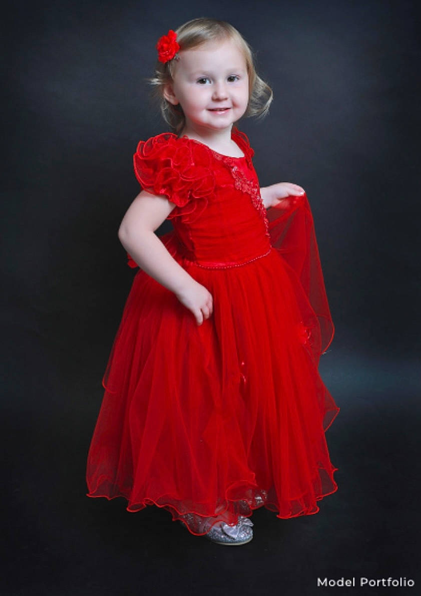 Lexie is registered to the contest to win money with this photo: bridal_party_dress, day_dress, dress, eye, face, fashion_design, flash_photography, formal_wear, hair, happy, head, joy, lip, one_piece_garment, person, pink, skin, sleeve, smile, toddler
