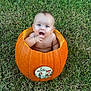 Liam is registered to the contest to win money with this photo: autumn, baby, child, cute, cute_baby, expression, fall, grass, holiday, infant, nature, orange, outdoor, person, playful, pumpkin, seasonal, sitting, smiling, young_child