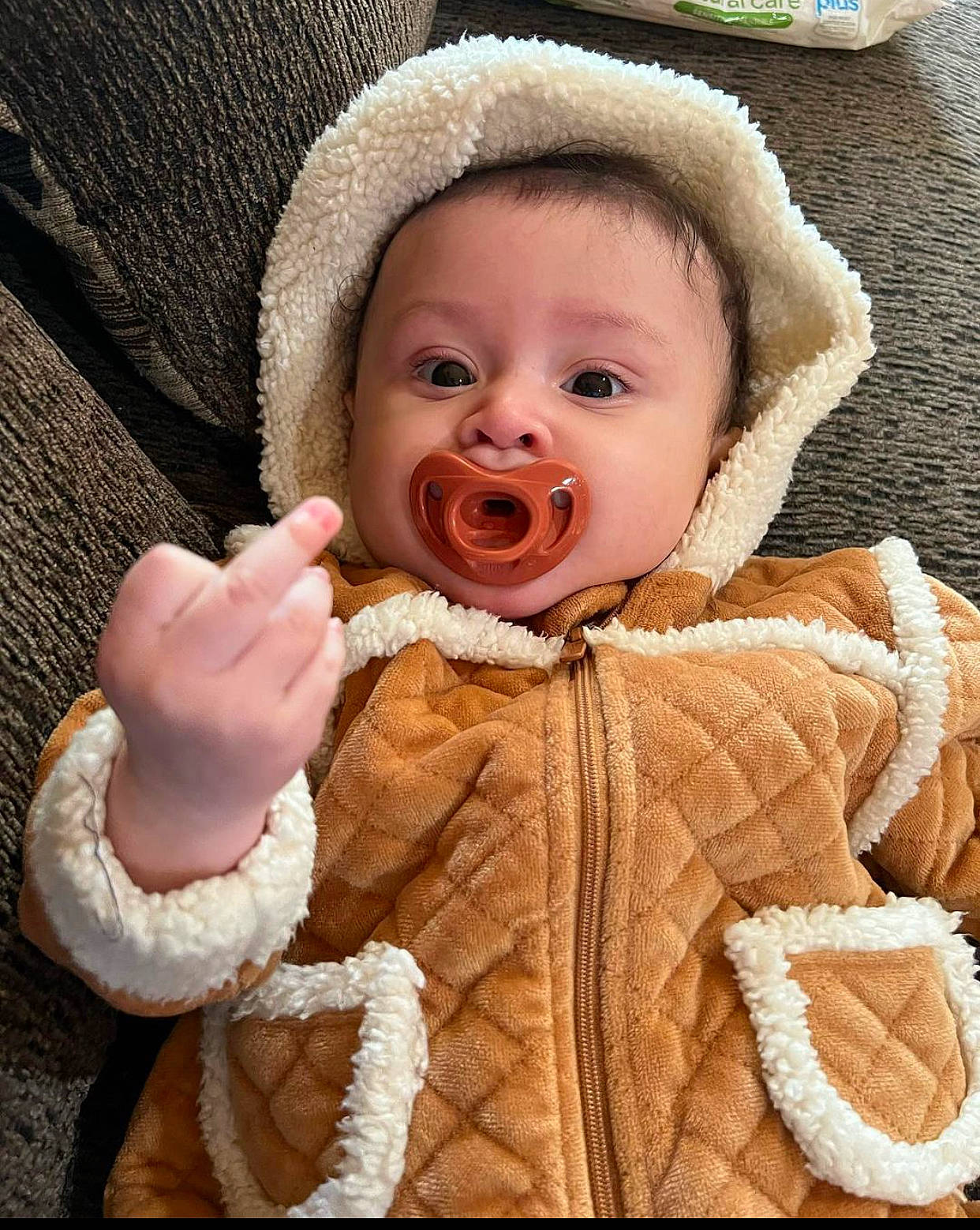 Ava Rose is registered to the contest to win money with this photo: baby, baby_toddler_clothing, cap, cheek, chin, eye, fur_clothing, gesture, happy, headgear, human_body, iris, jacket, lip, nose, organ, person, skin, sleeve, toddler