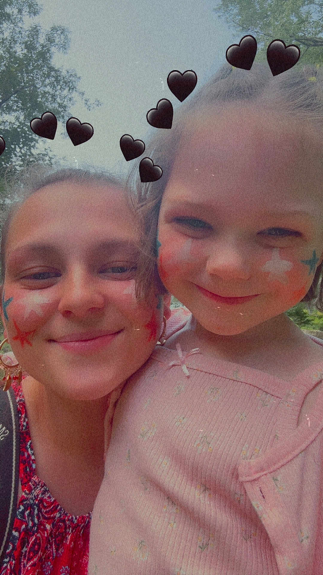 Lydia joined the competition — help win amazing prizes! child, adult, face_paint, smile, outdoor, trees, hearts, black_hearts, portrait, close_up, nature, happy, people, fashion, red_clothing, pink_clothing, woman, girl, cute, fun