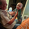 Matthew joined the competition — help win amazing prizes! baby, casual, child, clothing, elderly_man, family, furniture, happiness, holding, home, indoor, interaction, joy, lamp, living_room, person, portrait, seated, smile, supporting