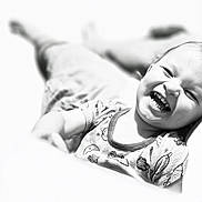 Matthew joined the competition — help win amazing prizes! baby, black_and_white, child, closeup, clothing, cute, expression, face, happy, high_key, joy, laughing, lying_down, monochrome, patterned_shirt, person, portrait, smile, toddler, young