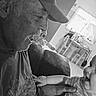 Matthew joined the competition — help win amazing prizes! affection, baby, black_and_white, cap, chair, elderly_man, face, furniture, home, human, indoor, interaction, joy, love, person, portrait, smile, table, tshirt, window