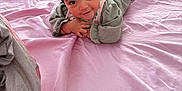 Hunter is registered to the contest to win money with this photo: adult, baby, bed, bedroom, blanket, bodypart, cap, clothing, face, finger, furniture, hand, hat, head, indoors, male, man, person, photography, portrait