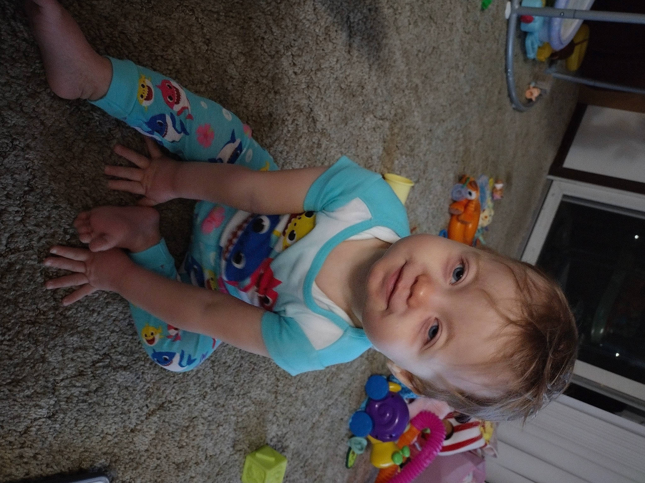 Raylee is registered to the contest to win money with this photo: baby, baby_toddler_clothing, child, elbow, finger, flooring, foot, fun, happy, human_leg, leisure, mouth, person, play, sitting, skin, smile, thigh, thumb, toddler