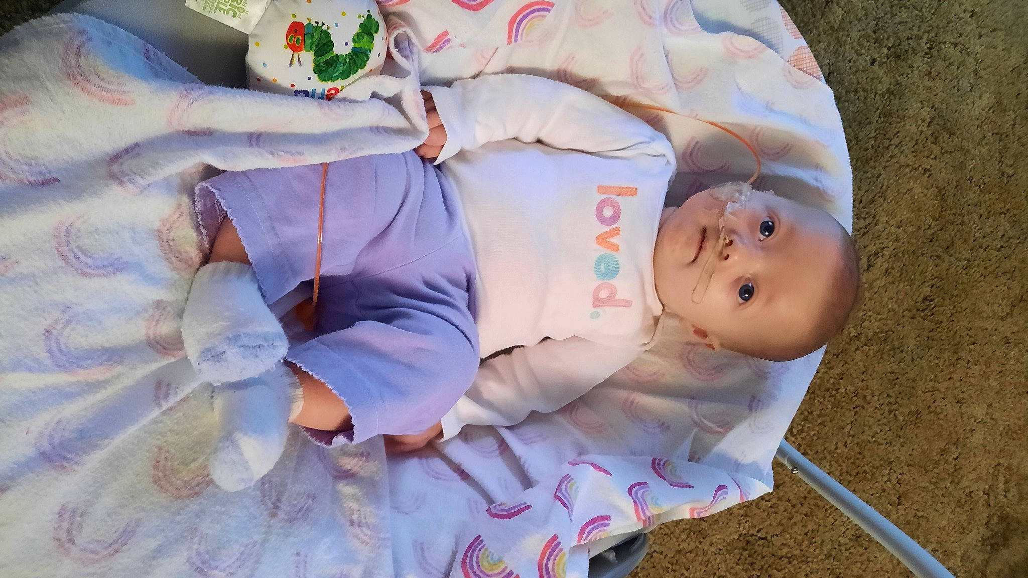 Raylee is registered to the contest to win money with this photo: baby, baby_products, baby_toddler_clothing, child, comfort, event, fun, happy, hat, human_body, linens, person, pink, toddler, white