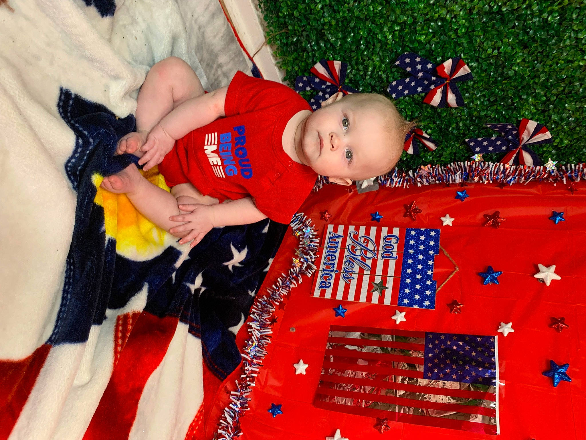 Jaxen is registered to the contest to win money with this photo: baby, baby_toddler_clothing, child, christmas_eve, event, fun, happy, holiday, pattern, person, play, red, room, sitting, smile, toddler, tree