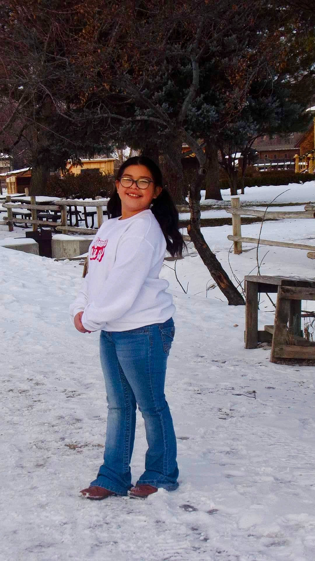 Destinee joined the competition — help win amazing prizes! branch, denim, electric_blue, facial_expression, freezing, fun, fur, happy, jeans, joy, leg, leisure, person, plant, recreation, smile, snow, standing, travel, tree