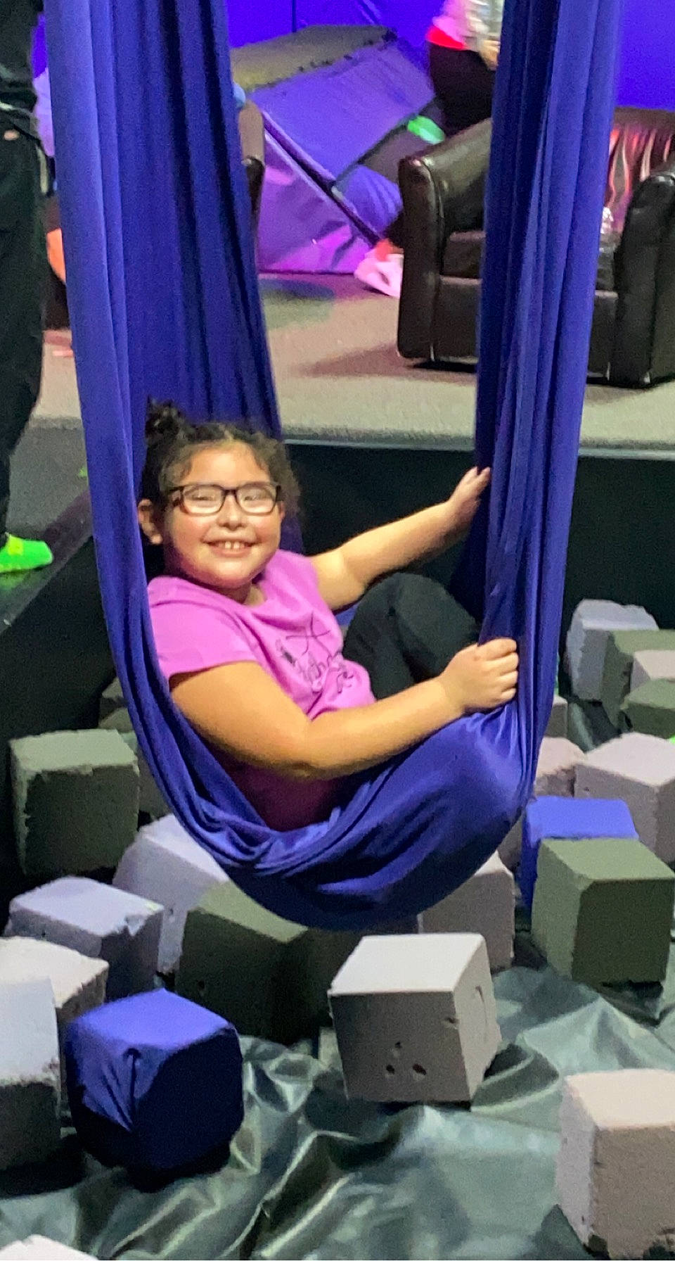 Destinee joined the competition — help win amazing prizes! box, chair, comfort, elbow, electric_blue, event, human_leg, job, joint, joy, lap, leisure, magenta, person, purple, room, service, shipping_box, sitting, smile