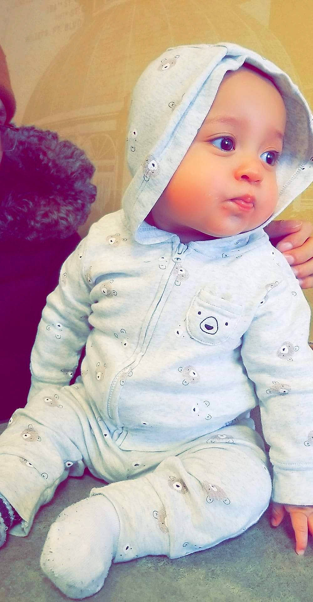 Andres is registered to the contest to win money with this photo: baby, baby_toddler_clothing, cheek, child, child_model, headgear, headwear, outerwear, person, pink, skin, sleeve, smile, toddler, white