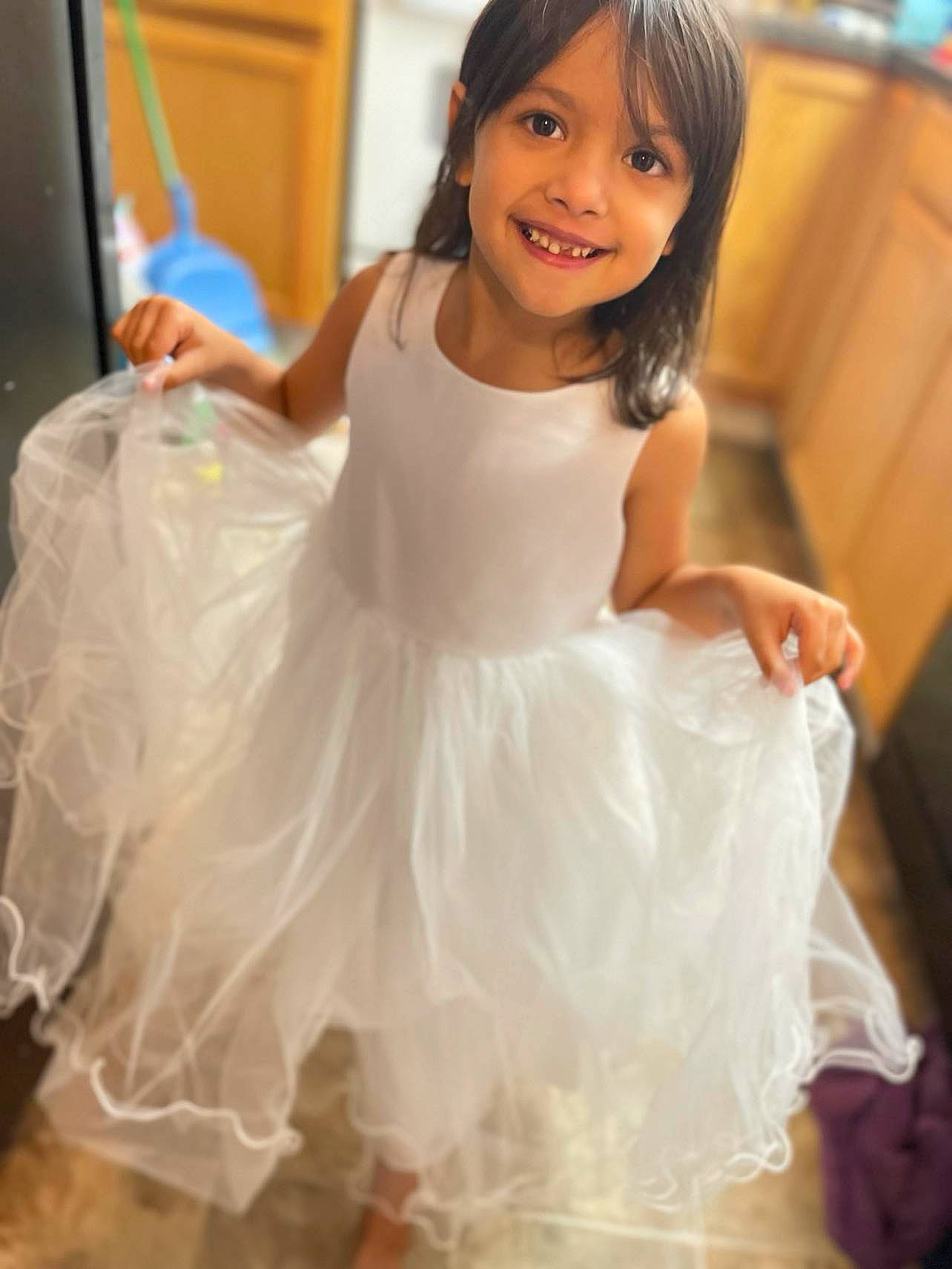 Brooklin is registered to the contest to win money with this photo: ballet_tutu, bridal_clothing, dance, dress, entertainment, event, face, fashion_design, flash_photography, flooring, formal_wear, gown, hair, happy, joy, long_hair, person, shoulder, sleeve, smile