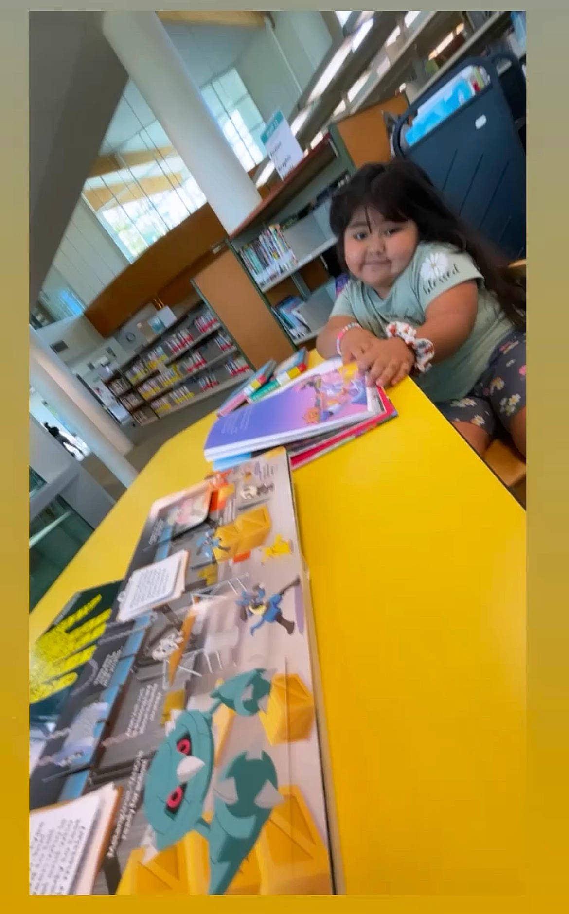 Irie joined the competition — help win amazing prizes! art, automotive_design, book, bookcase, child, flooring, fun, interior_design, leisure, paper_product, person, plastic, publication, recreation, room, shelf, shelving, t_shirt, table, toddler