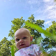 Kylie joined the competition — help win amazing prizes! baby, child, grass, greenery, outdoor, nature, trees, sky, blue_sky, smiling, infant, cute, sunlight, young_child, portrait, flora, daylight, casual_clothing, toddler, playful