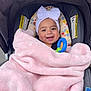 baby, blanket, bow, child, colorful, cushion, face, fluffy, headband, infant, outdoor, person, pink, portrait, stroller, smile, toy, wearing, young, happy