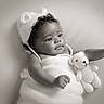 adorable, baby, black_and_white, child, cozy, cuddly_toy, cute, face, headwear, infant, knit_hat, knit_outfit, newborn, peaceful, portrait, resting, smiling, soft_texture, studio_photo, teddy_bear