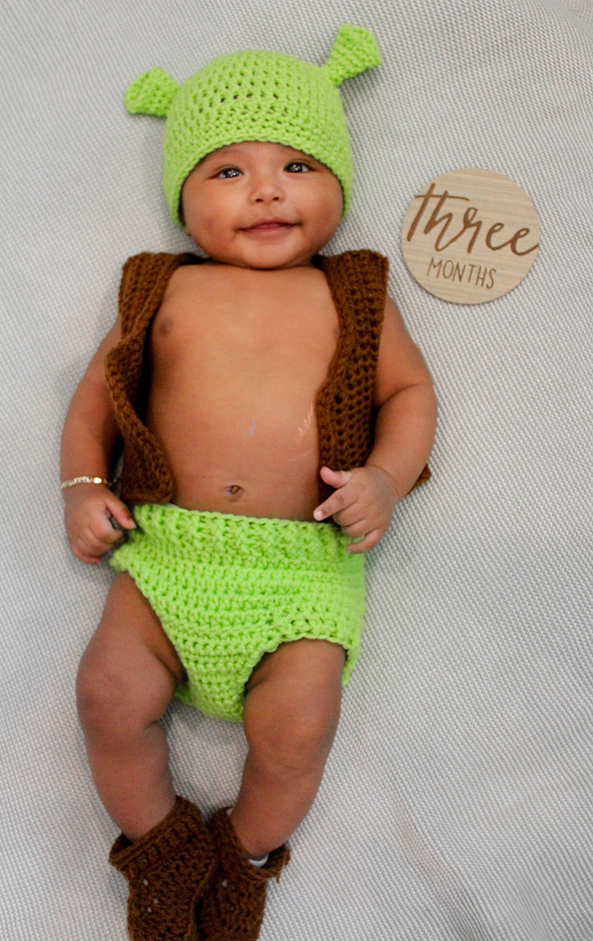 Elijah is registered to the contest to win money with this photo: accessories, baby, beanie, bodypart, bonnet, bracelet, cap, clothing, diaper, face, finger, glove, hand, hat, head, jewelry, newborn, person, photography, portrait