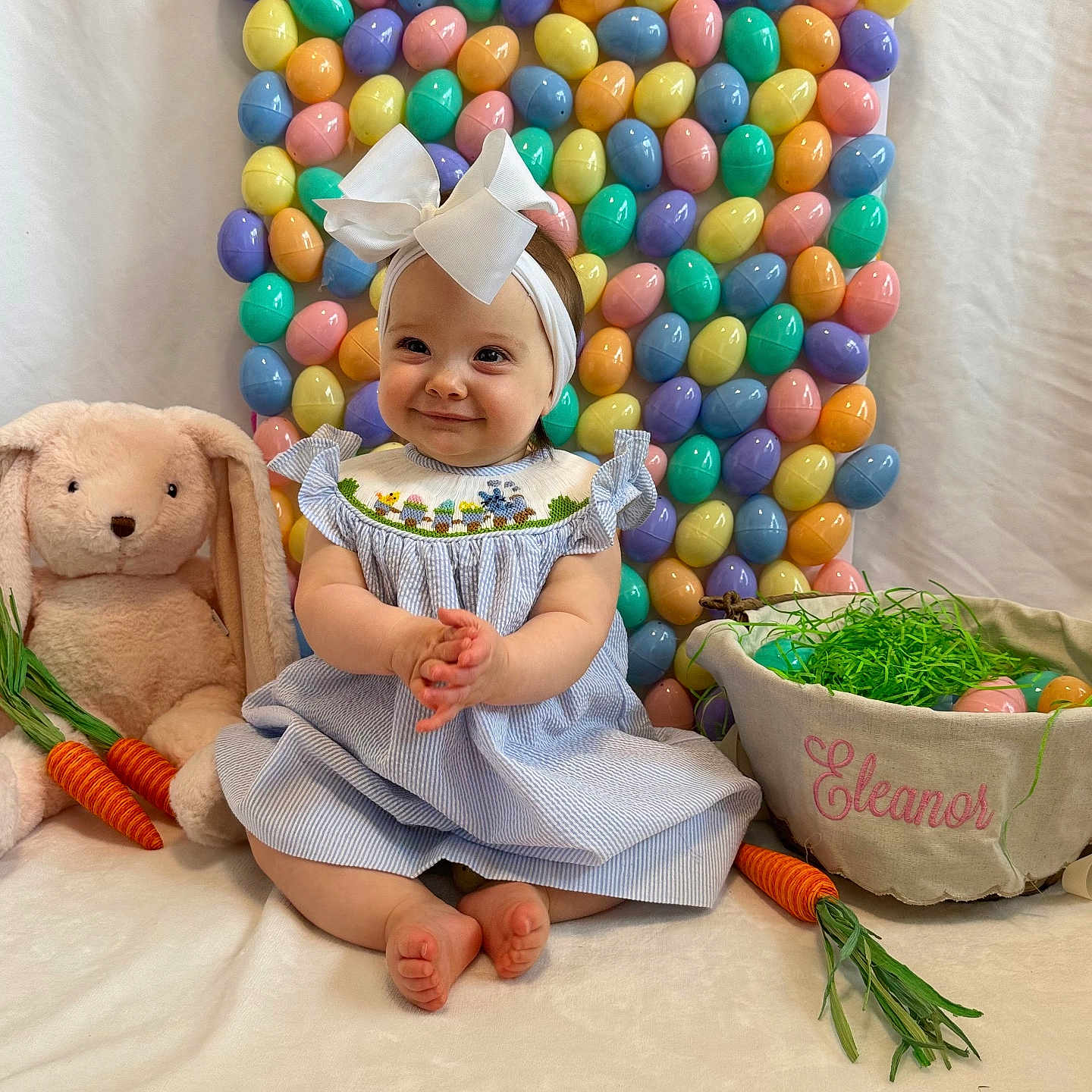 Ella is registered to the contest to win money with this photo: baby, balloon, cap, clothing, costume, face, flower, food, hat, head, indoors, people, person, photography, plant, portrait, pottedplant, sitting, teddybear, toy