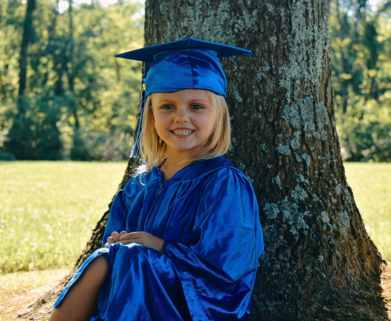 Raylynn is registered to the contest to win money with this photo: academic_dress, academic_institution, blue, clothing, college, diploma, dress, event, graduation, headgear, headwear, joy, mortarboard, outerwear, person, phd, public_event, robe, scholar, smile