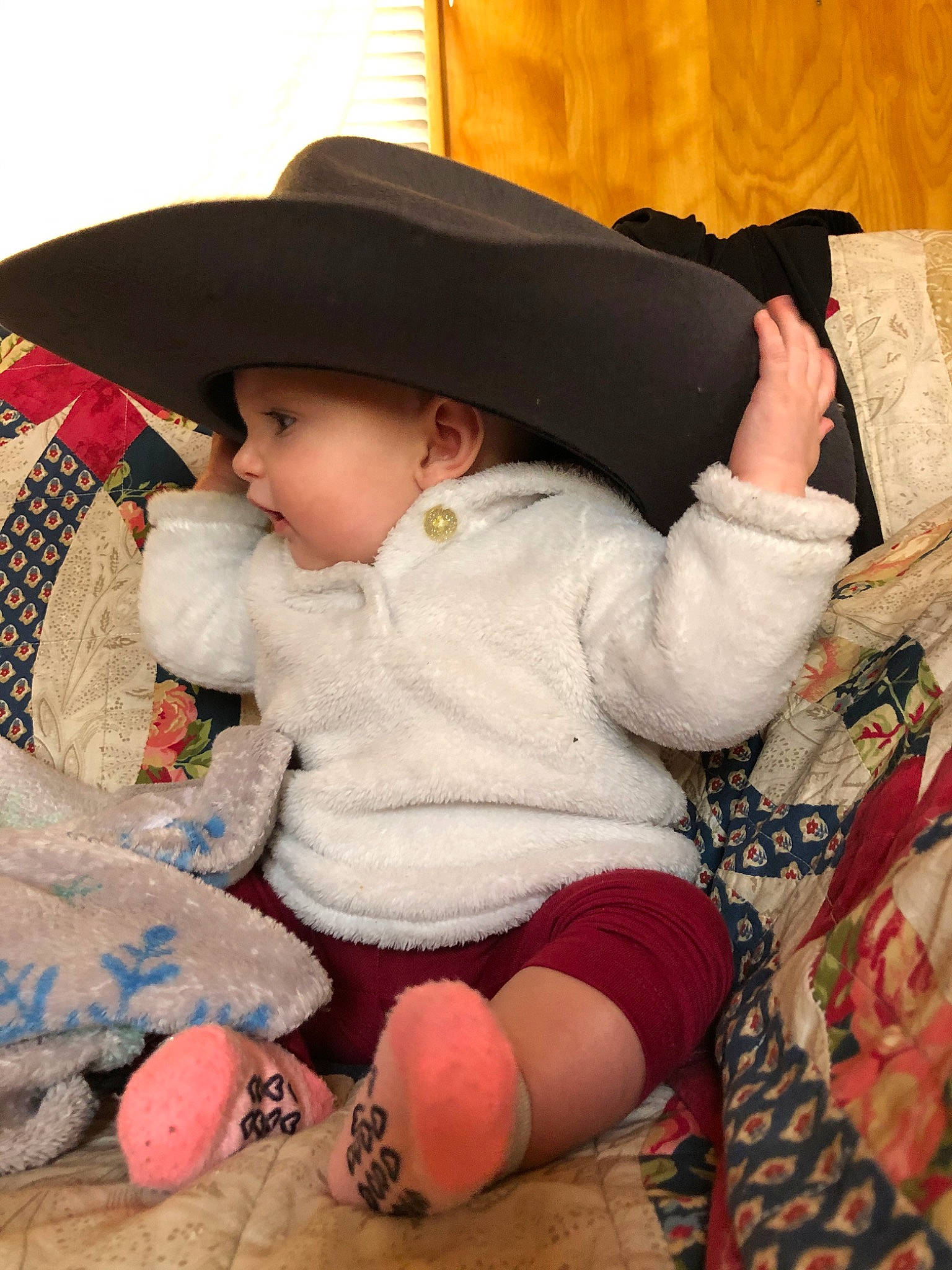 Abriella is registered to the contest to win money with this photo: baby, child, fashion_accessory, hat, headgear, headwear, person, play, sitting, skin, toddler