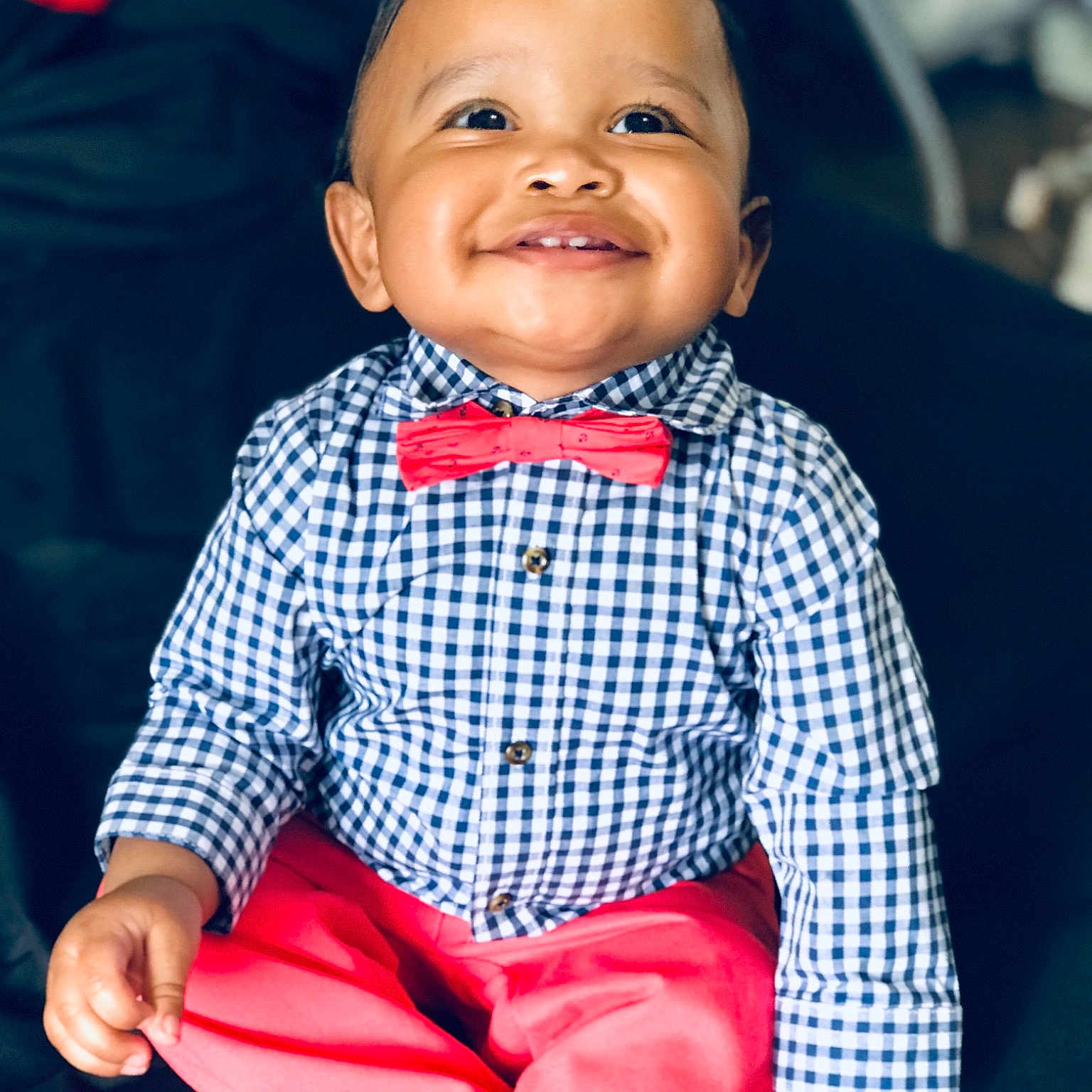 Cartier is registered to the contest to win money with this photo: baby, baby_products, baby_toddler_clothing, blue, bow_tie, cheek, child, chin, face, head, joy, lip, outerwear, person, pink, plaid, red, sitting, skin, smile