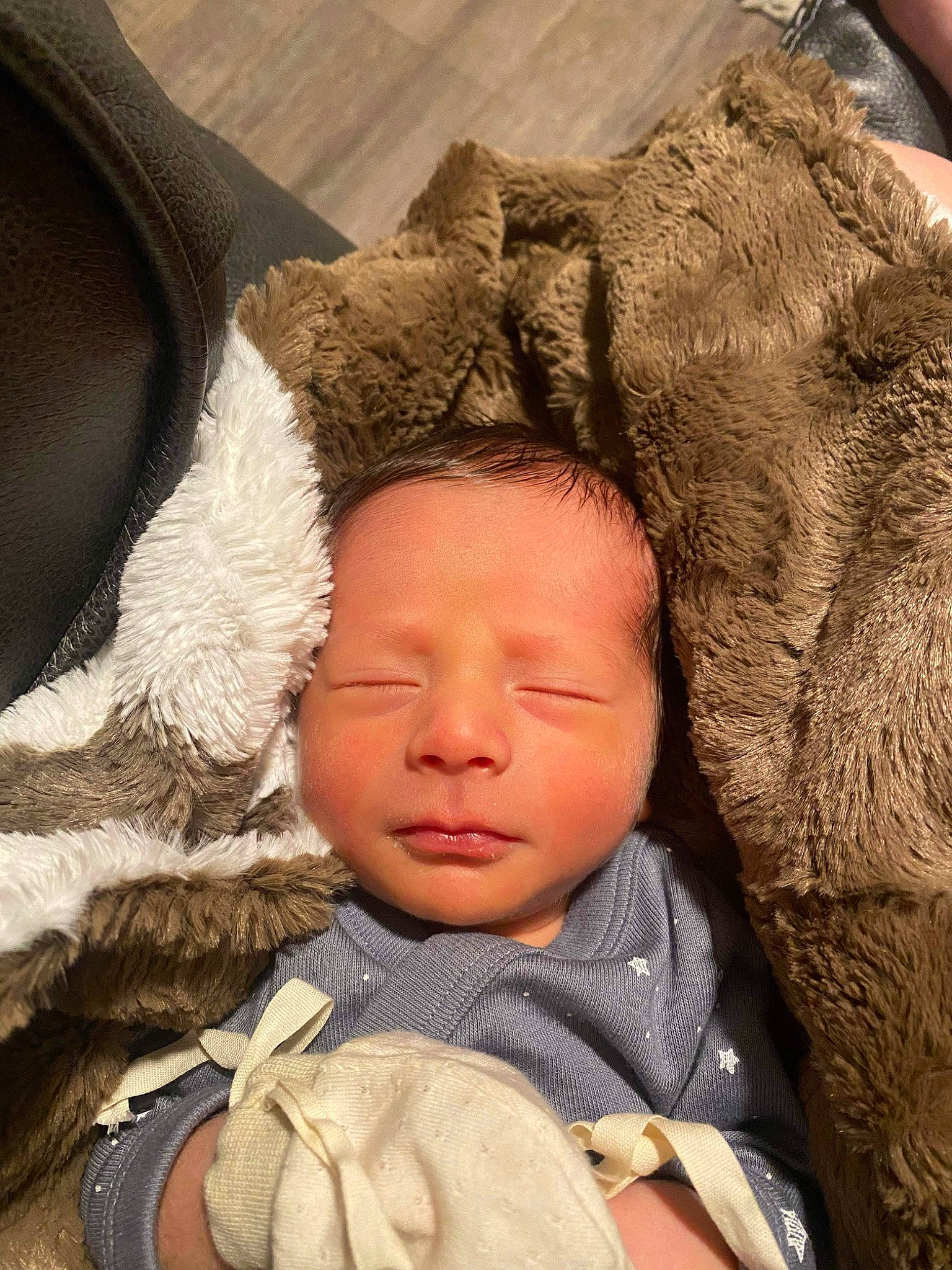 Daxton is registered to the contest to win money with this photo: baby, baby_products, baby_sleeping, bedtime, cheek, child, comfort, eye, eyelash, fur, gesture, happy, head, knit_cap, linens, nose, person, sitting, toddler, tree