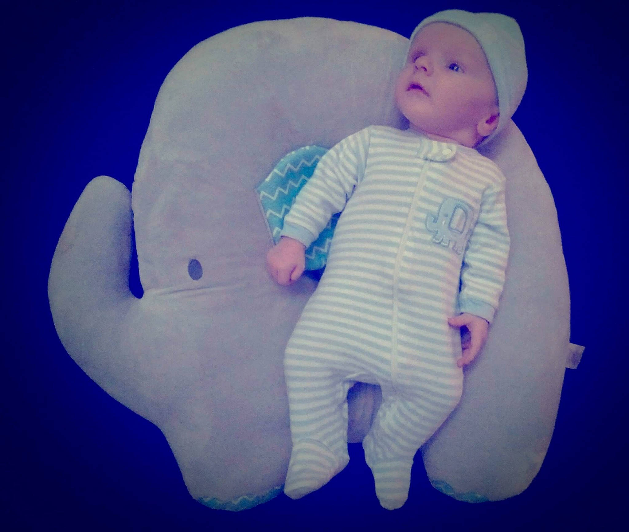 Lucius is registered to the contest to win money with this photo: baby, baby_sleeping, blue, child, cloud, hand, head, headwear, illustration, love, meteorological_phenomenon, person, product, sky, toddler