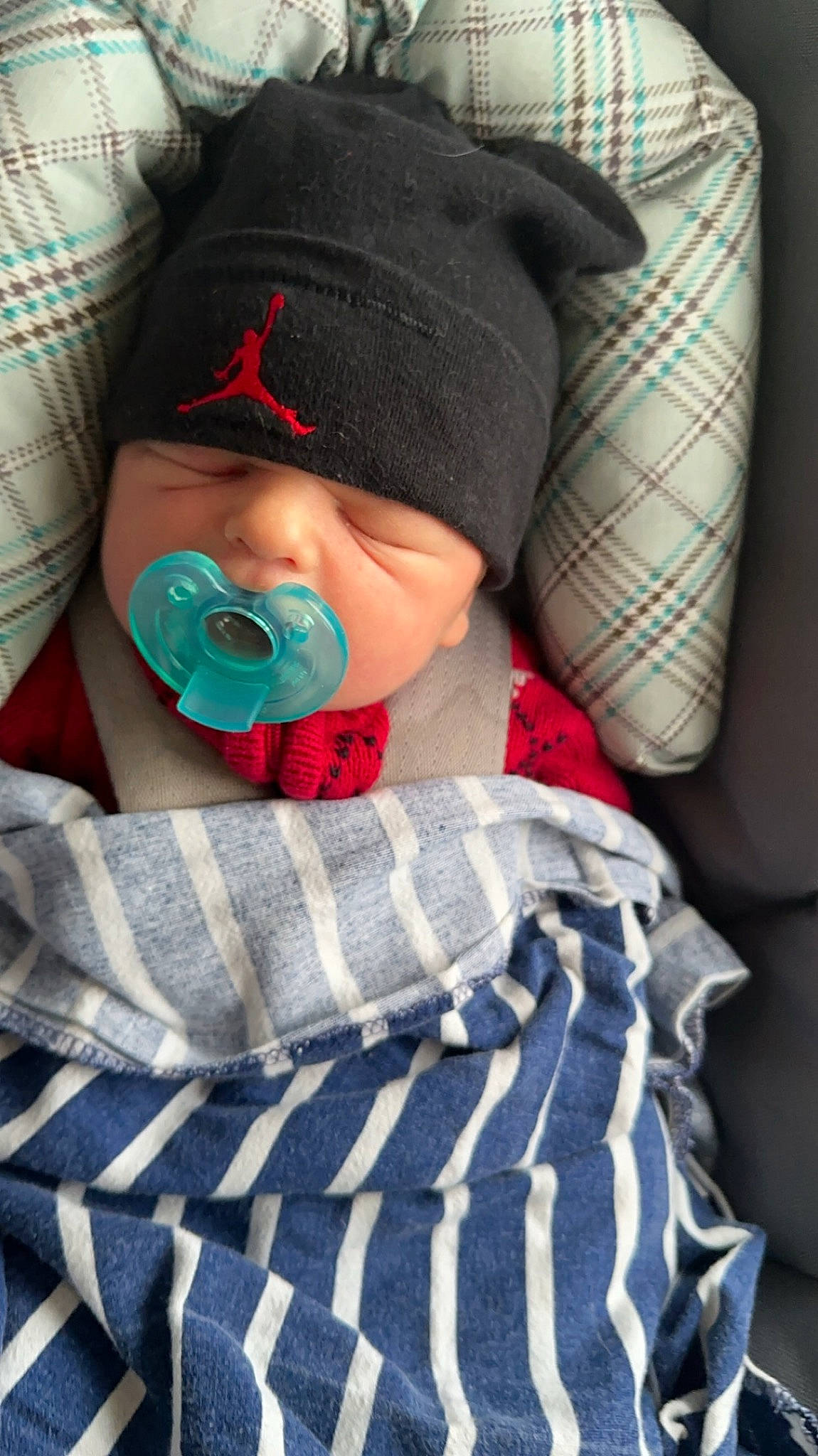 Gabriel joined the competition — help win amazing prizes! baby, baby_products, baby_sleeping, baby_toddler_clothing, cap, cheek, child, comfort, hat, headgear, headwear, linens, lip, mouth, pattern, person, plaid, sitting, sleeve, tartan