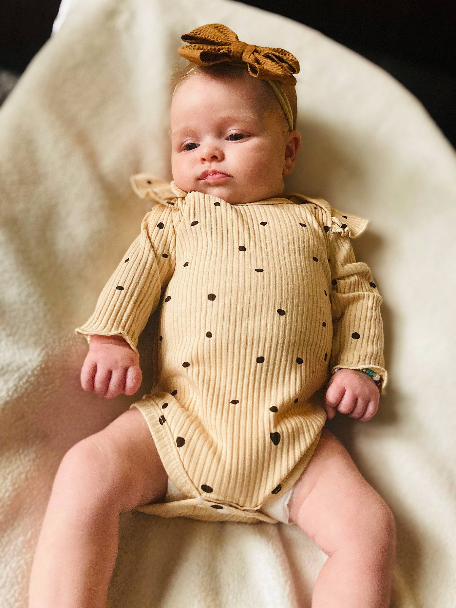 Abby is registered to the contest to win money with this photo: baby_toddler_clothing, collar, dress, eye, face, fashion_design, gesture, hairstyle, hand, head, headgear, lip, neck, outerwear, person, shoulder, skin, sleeve, thigh, toddler