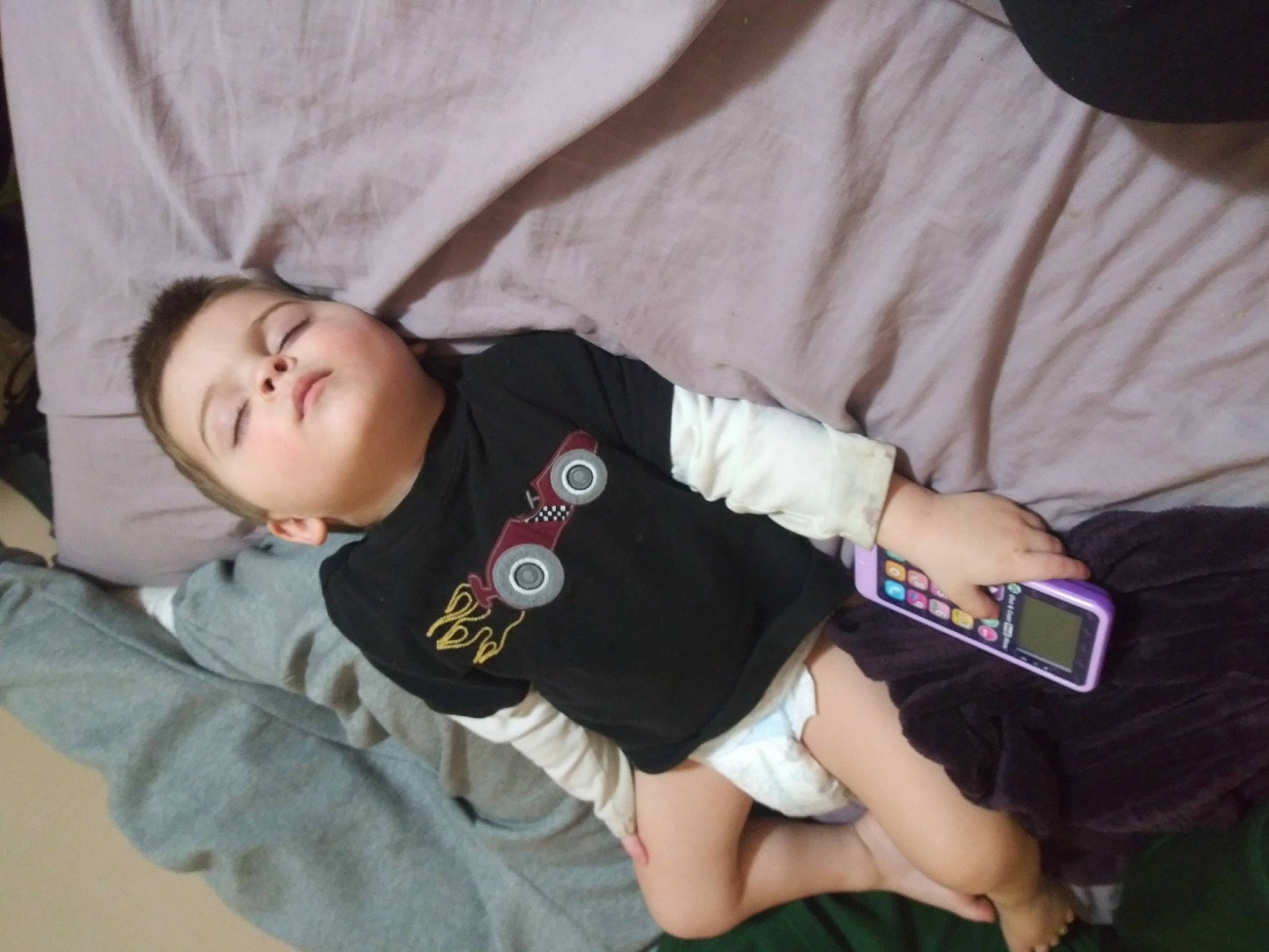 Jojo is registered to the contest to win money with this photo: arm, baby, baby_toddler_clothing, child, comfort, cool, couch, elbow, finger, fun, gesture, hand, joint, knee, person, sitting, sleeve, t_shirt, thigh, toddler