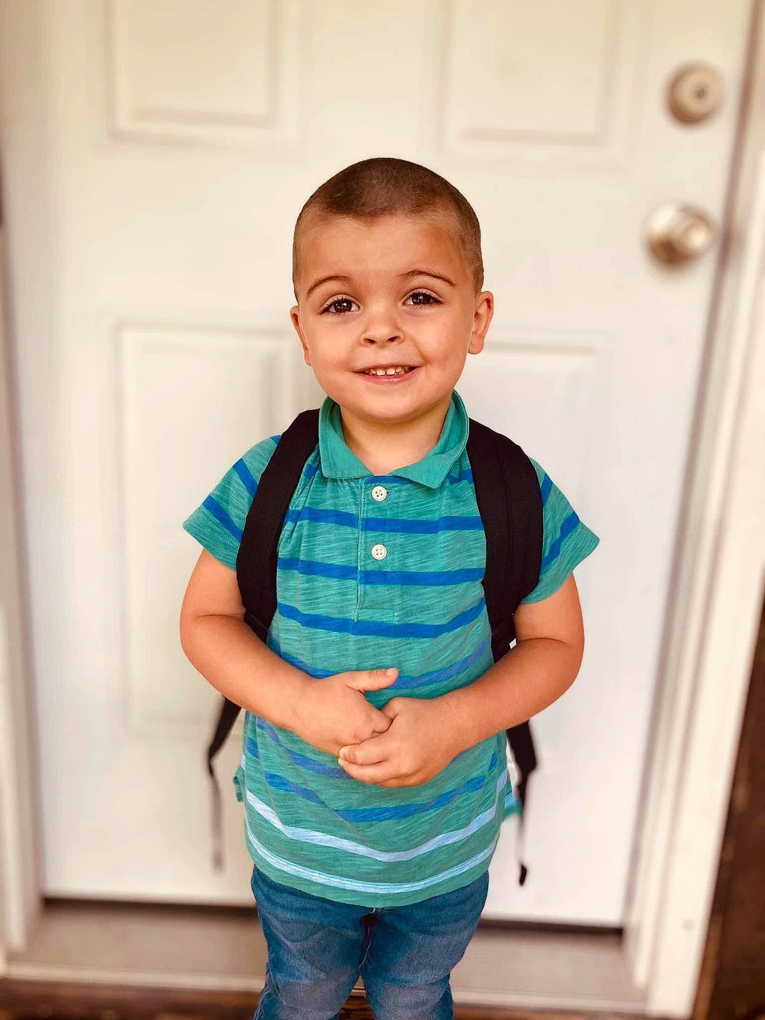 Jojo is registered to the contest to win money with this photo: baby_toddler_clothing, cheek, child, chin, elbow, electric_blue, face, flooring, gesture, happy, jeans, joy, person, skin, sleeve, smile, standing, t_shirt, thumb, toddler