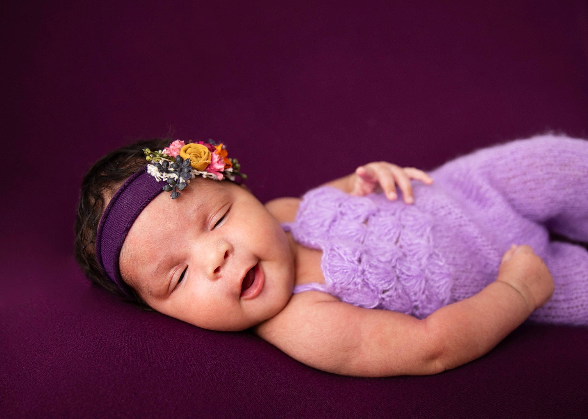 India is registered to the contest to win money with this photo: baby, baby_toddler_clothing, child, dress, eye, flash_photography, hair_accessory, hand, happy, hat, headband, headpiece, headwear, jewellery, magenta, person, purple, skin, sleeve, textile